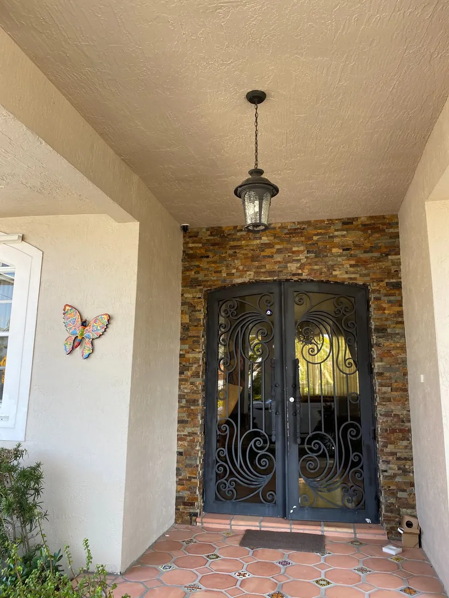 Security camera mounted above the front entrance of a Miami home