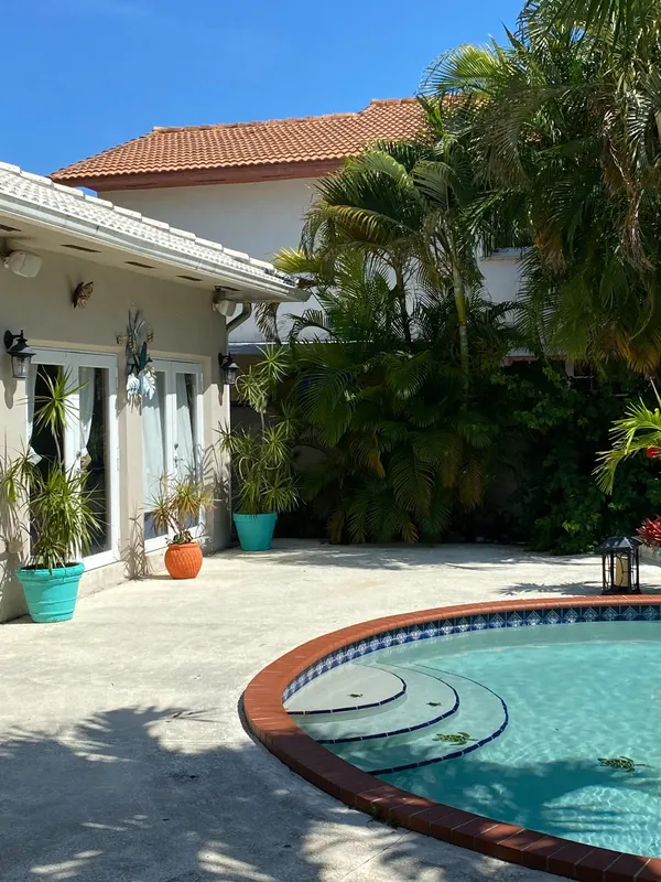 Security camera installed by Fidalgo overlooking a pool and backyard in Miami